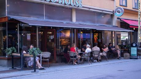 Sweden has recorded its highest number of deaths during the first half of the year since 1869, when the country was struck by famine. Pictured, a cafe in Stockholm. 