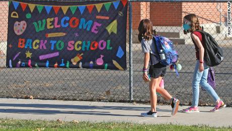 Students arrive at a Murray, Utah, school this week.