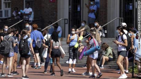 Colleges and universities across US halt in-person classes and begin campus monitoring after rising coronavirus cases