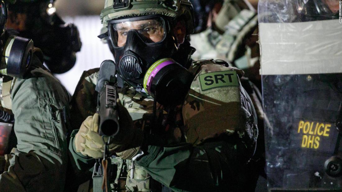 Federal officers are seen in the streets of Portland on August 19.