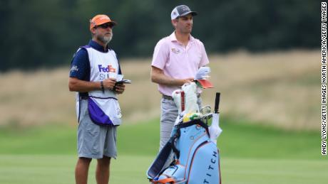Todd talks with his caddie on the seventh hole during the final round of the World Golf Championship-FedEx St Jude Invitational.
