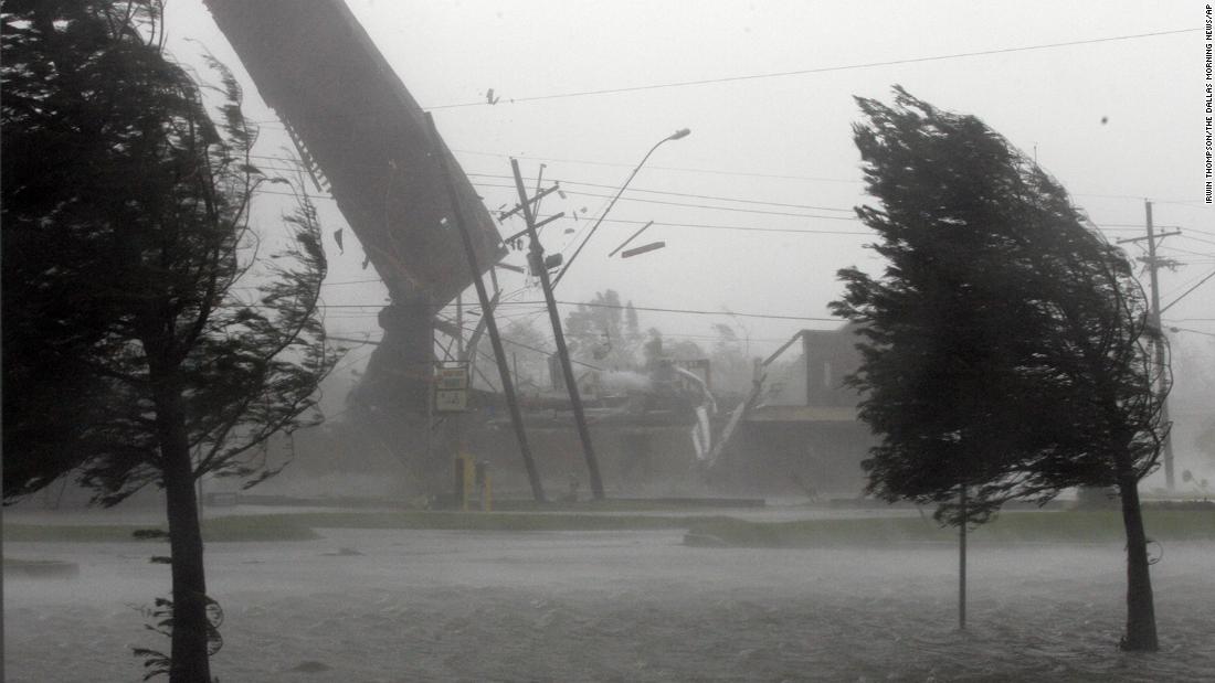 Strong winds blow the roof off the Backyard Barbeque restaurant in Kenner, Louisiana, as Katrina makes landfall on August 29, 2005.