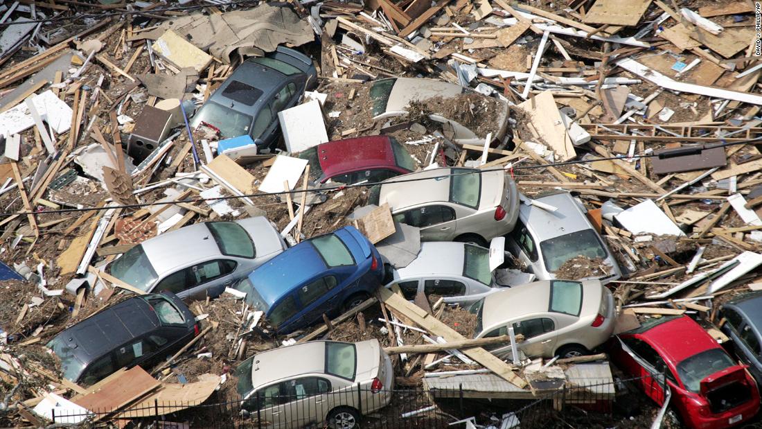 Cars are piled up in debris in Gulfport, Mississippi.