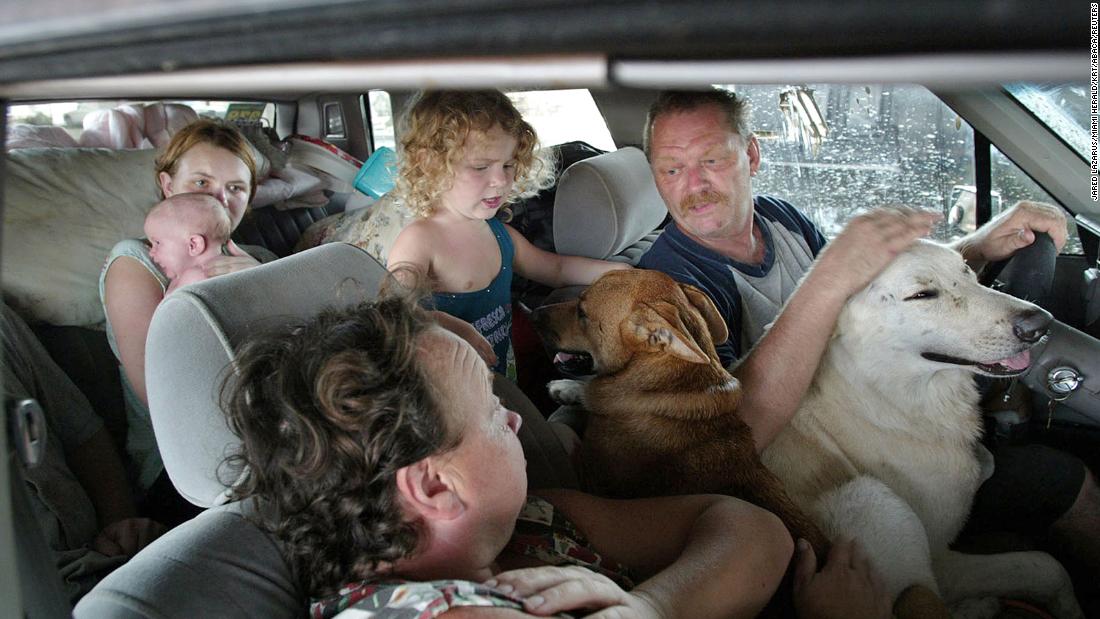 The Stump family stays in their car in Biloxi, Mississippi, after their home was destroyed by Katrina.