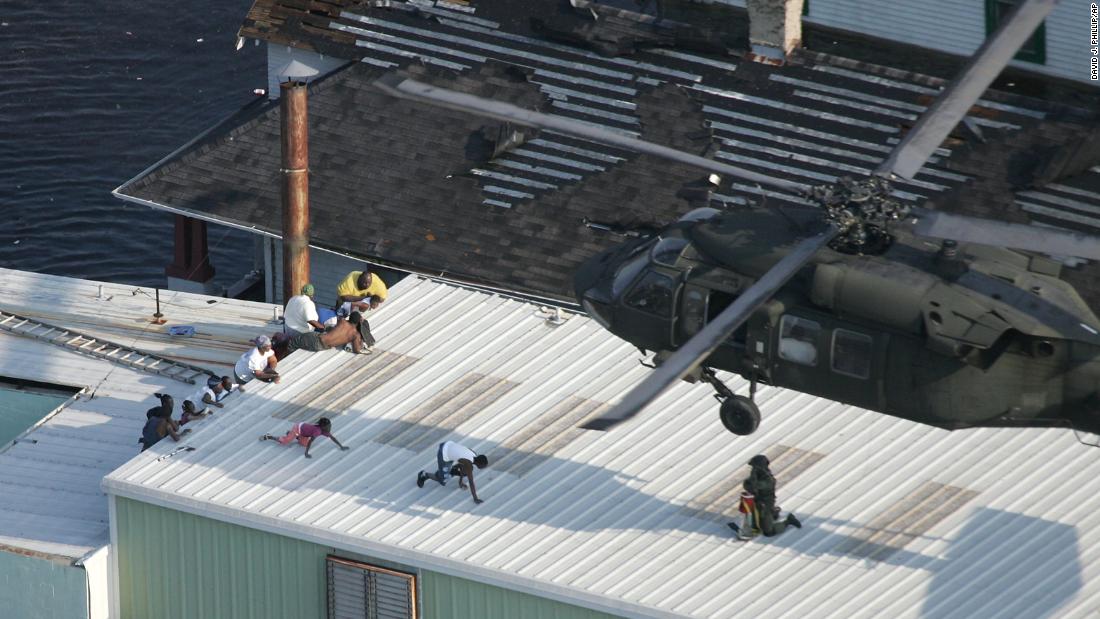 New Orleans residents are rescued by a helicopter on August 31, 2005, two days after Katrina made landfall.