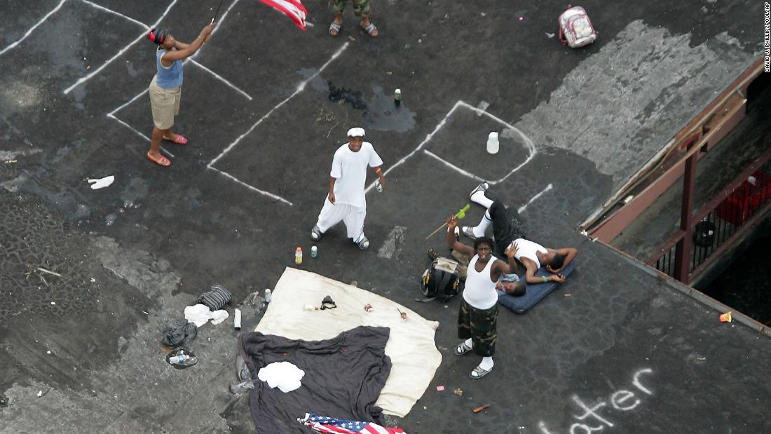 Residents wait to be rescued from a rooftop in New Orleans on September 1, 2005.