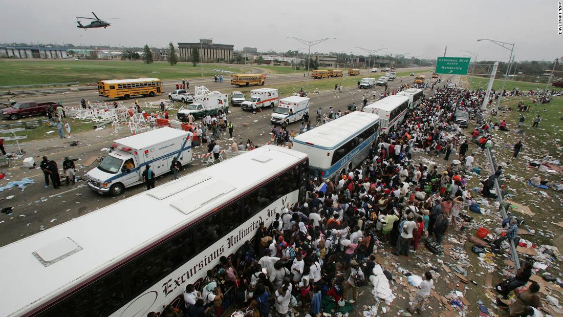 Thousands of New Orleans residents gather at a evacuation staging area along Interstate 10 in Metairie, Louisiana.