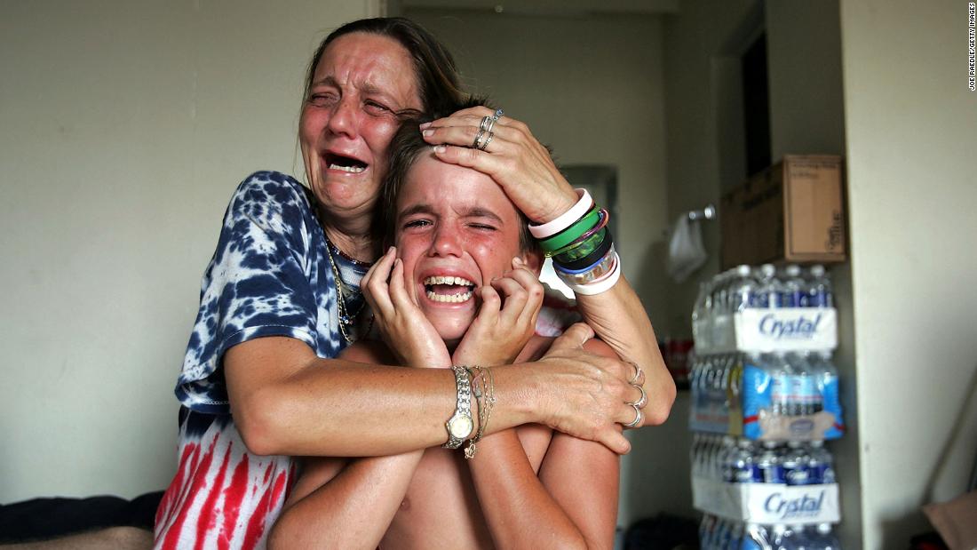 Charlene Veillon hugs her grandson Thearon Ellis after they learned that her daughter Joanna Ellis was killed during Hurricane Katrina in Waveland, Mississippi.