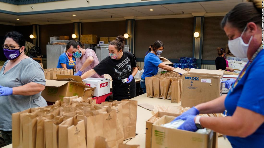 People pack brown-bag lunches at an evacuation center in Santa Cruz, California, on August 21.