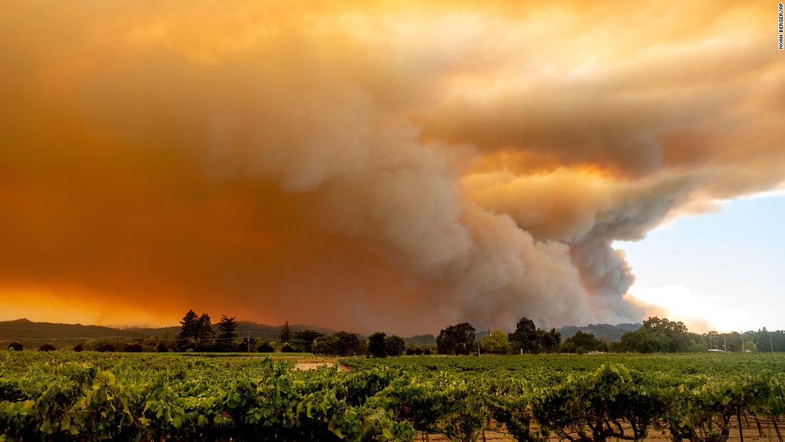 A smoke plume from the LNU Lightning Complex fires billows over Healdsburg, California, on August 20.