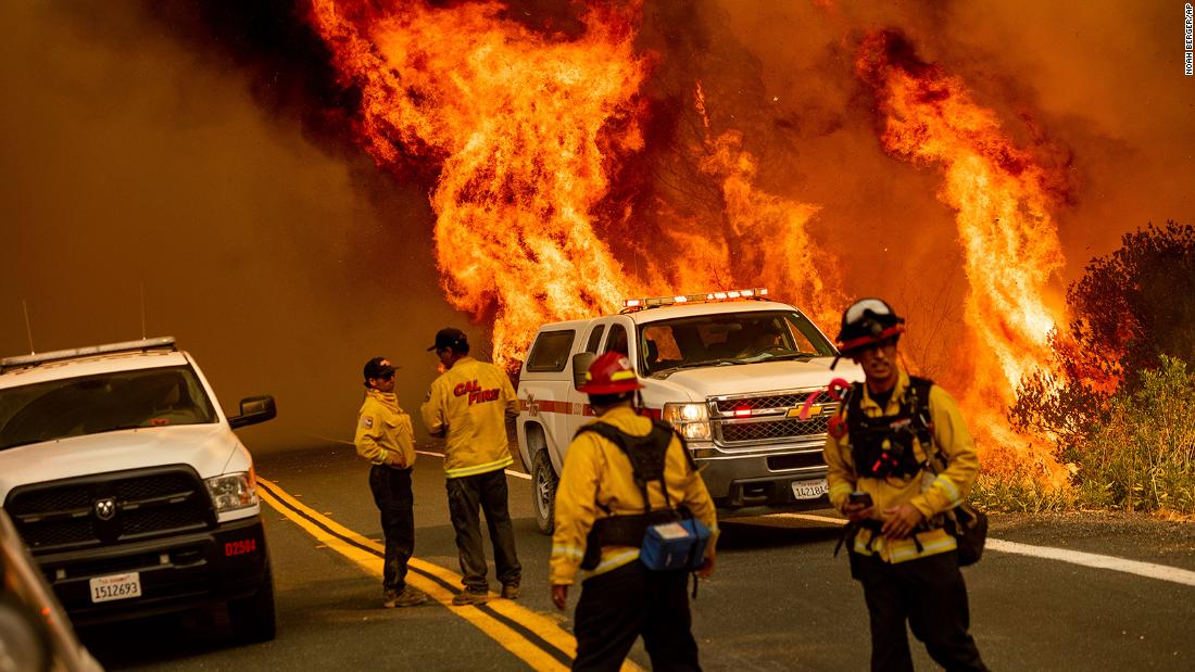 Flames from the LNU Lightning Complex fires leap above Butts Canyon Road in Lake County on August 23.