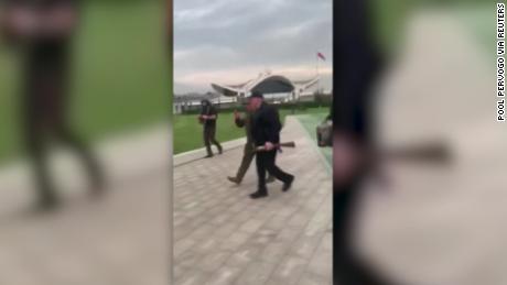 Screengrab of BELARUSIAN PRESIDENT ALEXANDER LUKASHENKO WALKING NEAR PRESIDENTIAL PALACE WITH ASSAULT RIFLE, POINTING TO PLACE WHERE PROTESTERS HAVE BEEN SAYING (Russian) &quot;Nobody is left there, right?
