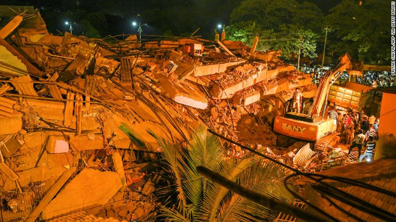 Up to 60 people are believed to be trapped after the five-story building in Mahad city collapsed.