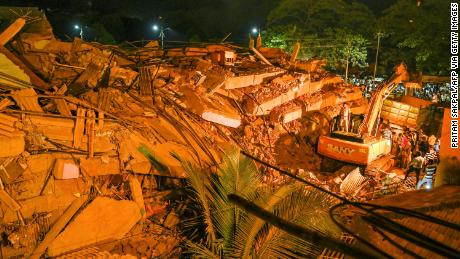 Up to 60 people are believed to be trapped after the five-story building in Mahad city collapsed.