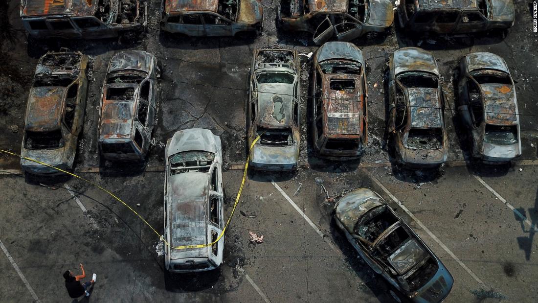 Vehicles that were burned during protests are seen in Kenosha on August 24.