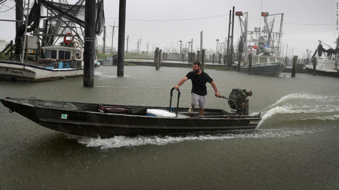 Michael Kent moves his boat in Venice, Louisiana, on August 23.