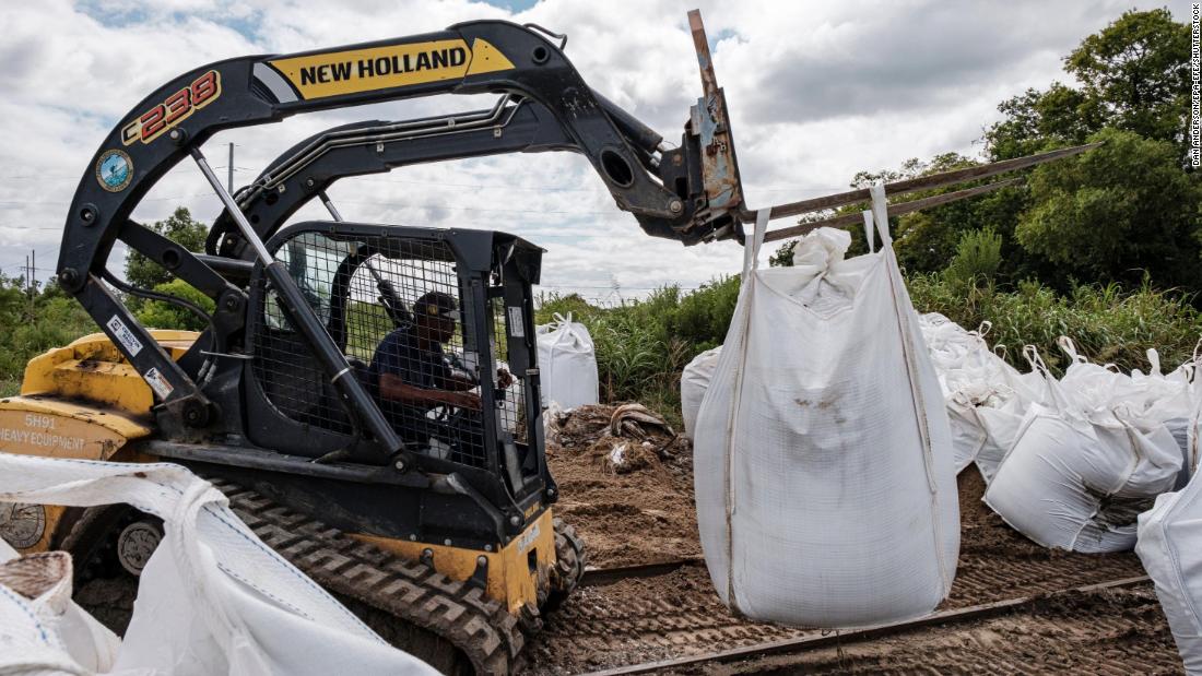 Crews bring sandbags to help with flooding prevention in Belle Chasse, Louisiana.