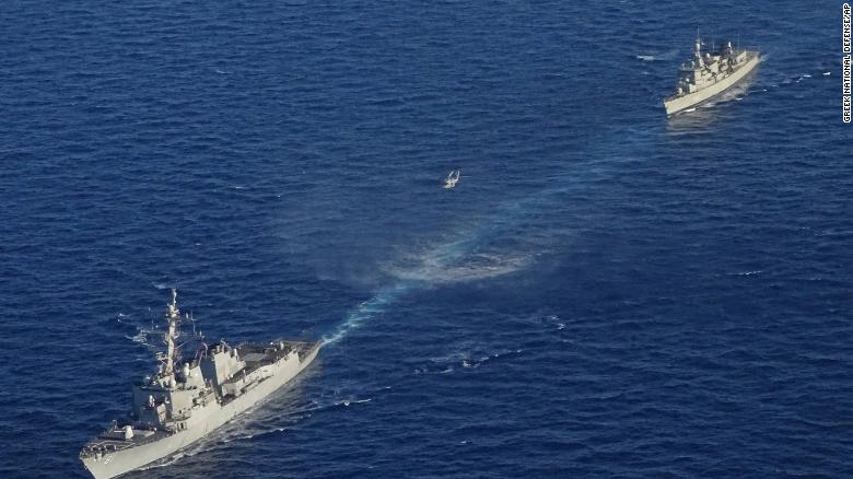 In this photo provided by the Greek National Defense Ministry, warships take part in a Greek-US military exercise south of the island of Crete, on Aug. 24, 2020. 