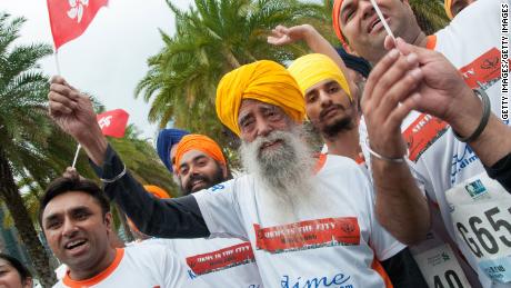 Fauja Singh, at 101 years old, participates in the 10K run during the 2013 Hong Kong Marathon.