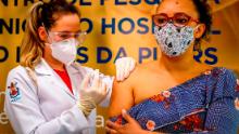 A volunteer receives a COVID-19 vaccine produced by Chinese company Sinovac Biotech at the Sao Lucas Hospital, in Porto Alegre, southern Brazil on August 08, 2021.