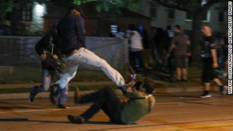 KENOSHA, WISCONSIN, USA - AUGUST 25: Clashes between protesters and armed civilians, who protect the streets of Kenosha against the arson, break out during the third day of protests over the shooting of a black man Jacob Blake by police officer in Wisconsin, United States on August 25, 2020. (Photo by Tayfun Coskun/Anadolu Agency/Getty Images)