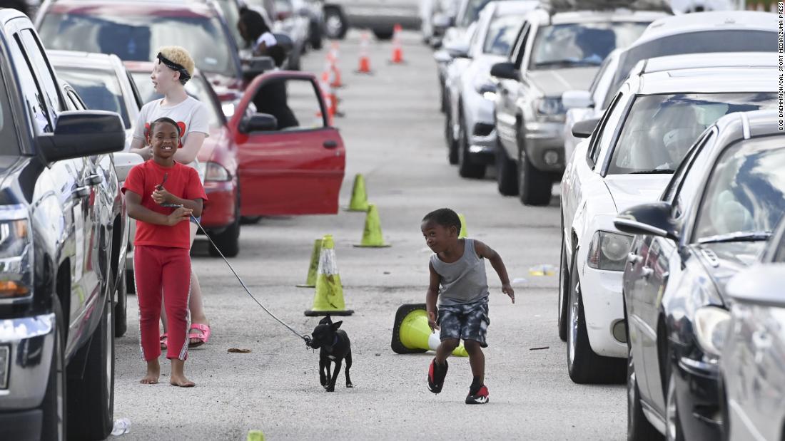 Children play at the Circuit of the Americas racetrack, where some evacuees were settling in Austin, Texas, on August 26.