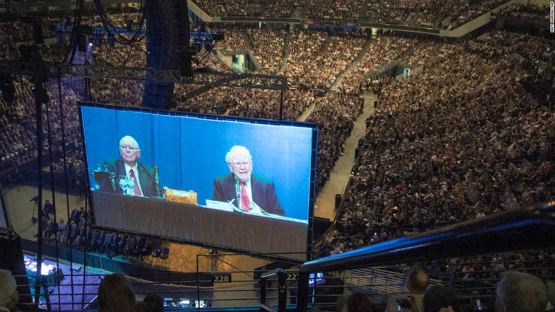 Buffett and Berkshire Hathaway Vice Chairman Charlie Munger are seen on a giant screen during the Berkshire Hathaway shareholders meeting in 2013.