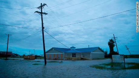 Flooding is seen Thursday in Sabine Pass, Texas.