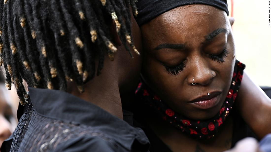 Letetra Wideman and Zanetia Blake, sisters of Jacob Blake, embrace during a news conference outside the Kenosha County Courthouse.