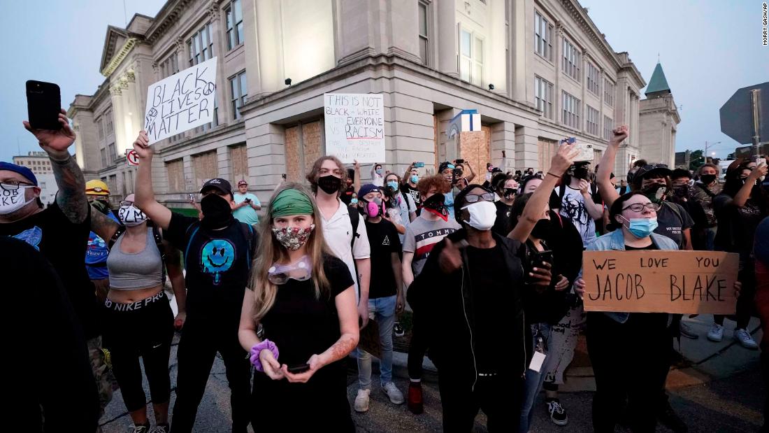 People gather to protest on August 25.