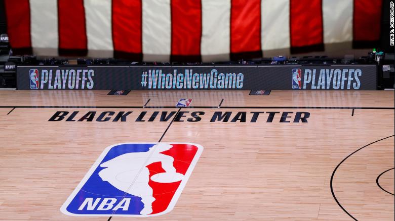 An empty court and bench are shown following the scheduled start time of Game 5 of an NBA first-round playoff series.