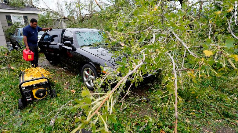 Reginald Duhon prepares to clean up around his home in Lake Charles, Louisiana, after Hurricane Laura moved through the state on Thursday, August 27.