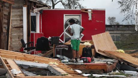 James Sonya surveys what is left of his uncle&#39;s barber shop Thursday in Lake Charles, Louisiana. 