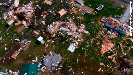 This aerial view shows the damage caused by Hurricane Laura in a neighborhood outside Lake Charles, Louisiana.  President Donald Trump and Vice President Mike Pence mentioned the storm, but did not link it to the climate crisis.