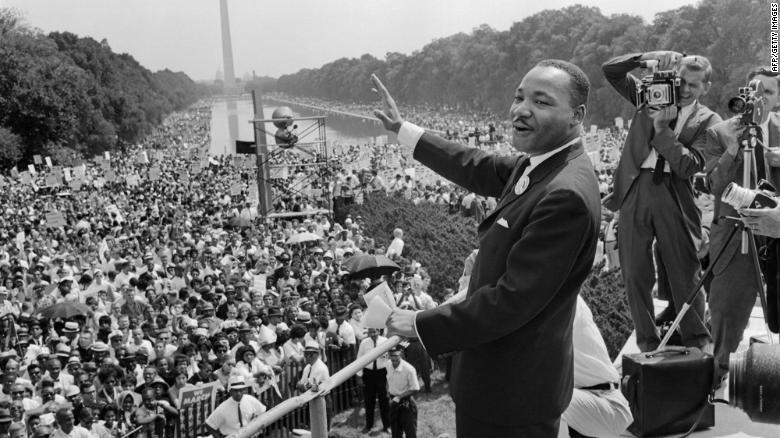 Martin Luther King waves to supporters during the 1963 March on Washington.