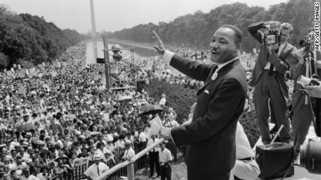 Martin Luther King waves to supporters during the 1963 March on Washington.