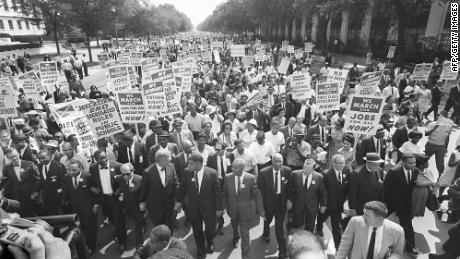 Dr. Martin Luther King Jr, third from left, and other civil right leaders lead the 1963 March on Washington.