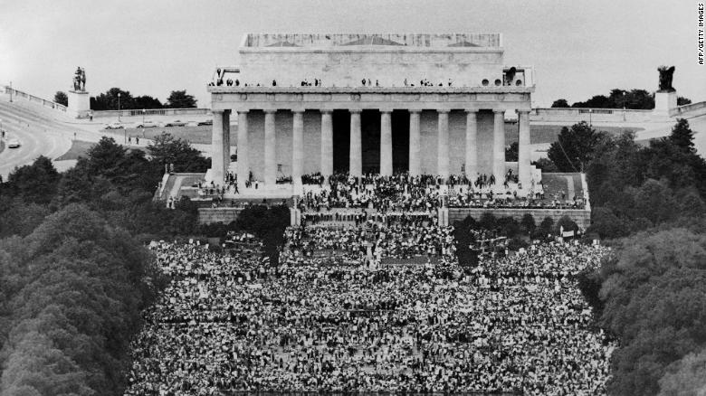 Hundreds of thousands of people gather for the March on Washington for Jobs and Freedom at the Lincoln Memorial on August 28, 1963.