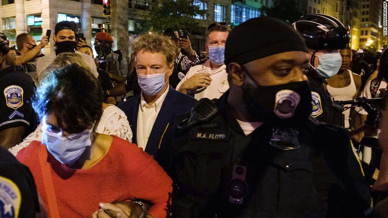 Protesters surround Sen. Rand Paul after the RNC