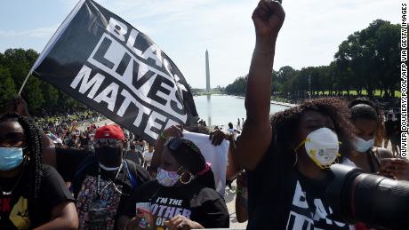 Demonstrators gather outside the Lincoln Memorial for Friday's march.