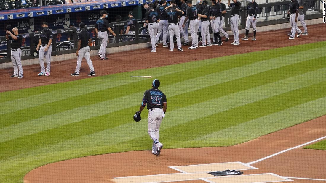 Miami Marlins outfielder Lewis Brinson walks off the field August 27 after placing a Black Lives Matter T-shirt on home plate in New York. The Marlins and New York Mets walked off the field after a moment of silence, choosing not to play their scheduled baseball game. 