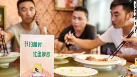 A sign encouraging people not to waste food is seen at a restaurant in Handan in China&#39;s northern Hebei province on August 13.