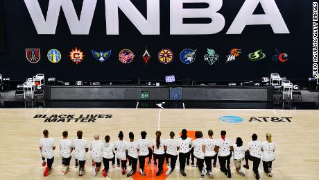 The Washington Mystics each wear white T-shirts with seven bullet holes on the back at Feld Entertainment Center on August 26, 2020 in Palmetto, Florida, as they protest the shooting of Jacob Blake by Kenosha, Wisconsin police 