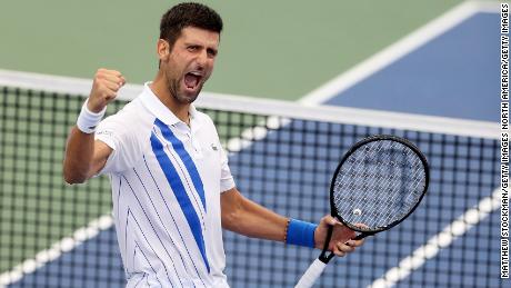 Djokovic celebrates defeating Milos Raonic in the final of the Western &amp; Southern Open.
