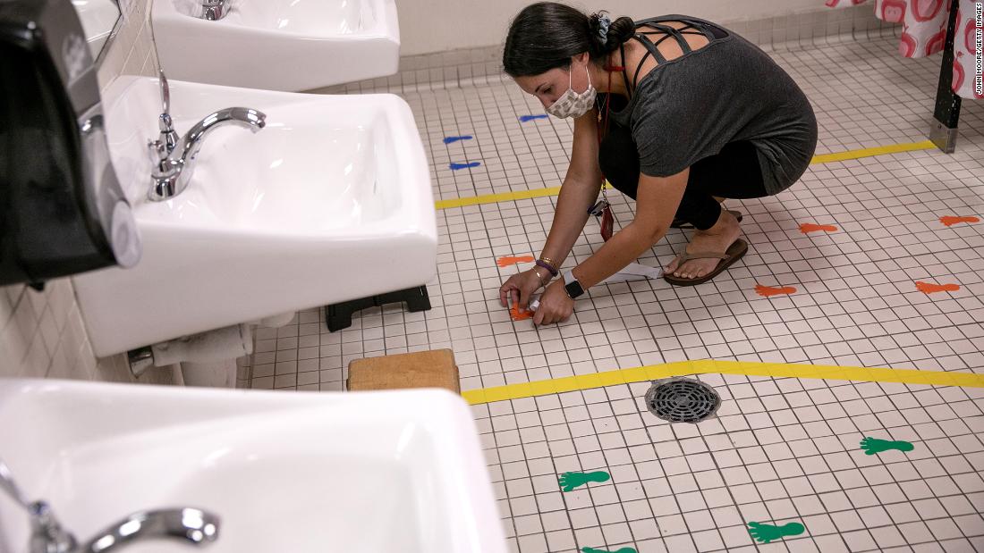 A preschool teacher in Stamford, Connecticut, prepares a student bathroom August 26 for the upcoming semester.