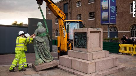 A statue of slave trader Robert Milligan is removed near the Museum of London Docklands in June.