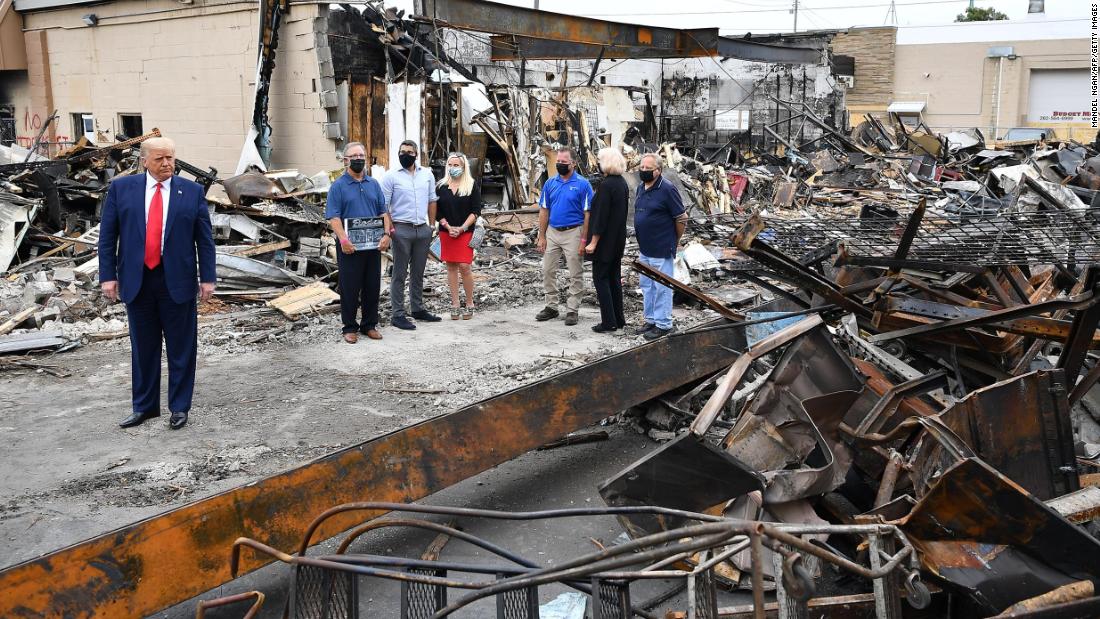 Trump tours a building that was damaged during the protests in Kenosha.