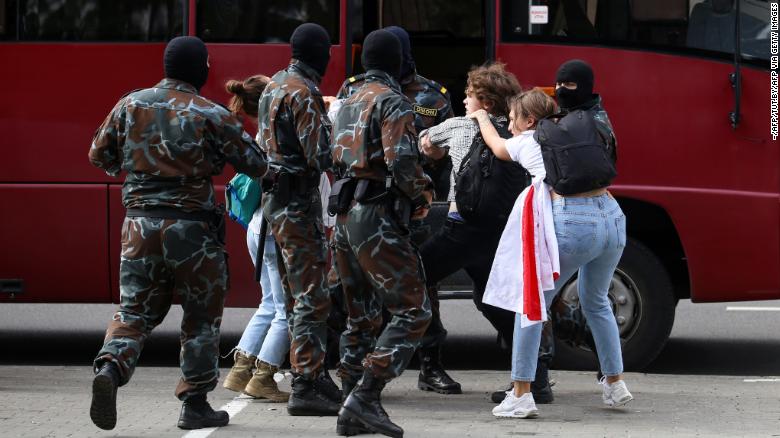 Security officers detain students during an anti-Lukashenko protest on Tuesday in Minsk. 