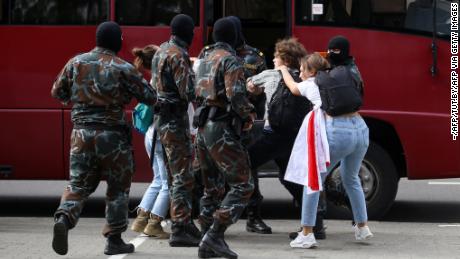 Security officers detain students during an anti-Lukashenko protest on Tuesday in Minsk. 