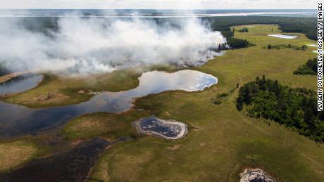 Aerial view of a forest fire in central Yakutia, in Russia&#39;s Sakha Republic. Forests are estimated to cover at least 256,107 hectares in Yakutia -- 83.4% of its whole territory.